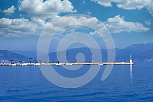 small white boats in the harbor seascape Nafplio Greece photo