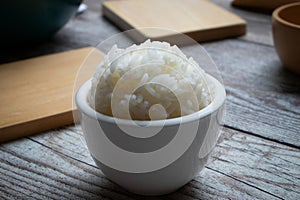 Small white bowl with white rice.