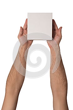 Small white cardboard boxes in male hands. Top view. Isolate