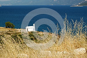 Small white church on the Aegean coast