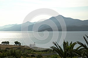 A small white church on the Aegean coast in the morning