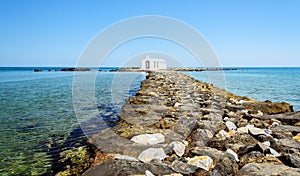 Small white church in sea near Georgioupolis town on Crete island