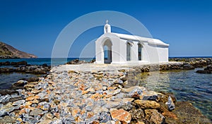 Small white church in sea near Georgioupolis town on Crete island