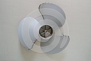 Small white fan with 4-blade propeller repair