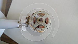 Small white fan with 4-blade propeller repair