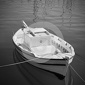 Small white fishing boat in the harbour