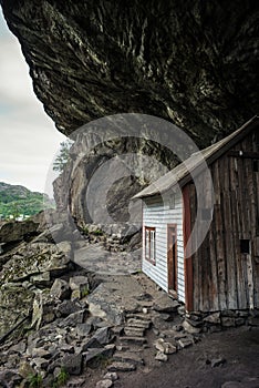 Small white, fishing house norway rock.