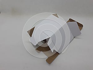 A small white foldable paper boxes in white isolation background