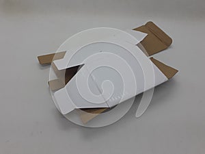 A small white foldable paper boxes in white isolation background