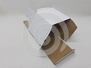 A small white foldable paper boxes in white isolation background