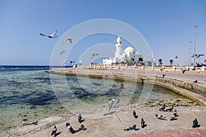 Small white mosque built on the Corniche right on the shores of the Red Sea in Jeddah, Saudi Arabia