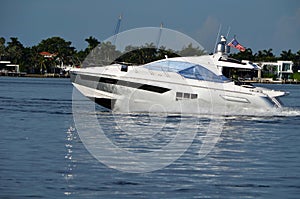 Small white motor yacht on the Florida Intra-Coastal Waterway