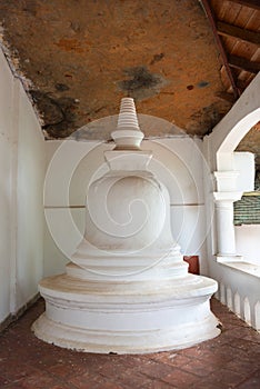 Small white pagoda in buddhist temple