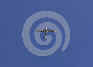 Small white plane seen from below