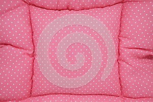 Small white polka dots on pink background fabric