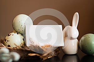 Small white rabbit figurine with easter eggs
