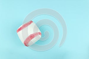 Small white red ball for baseball sport game on blue background