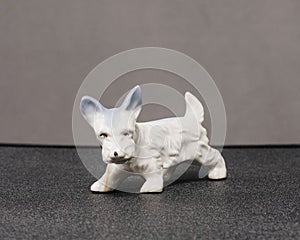 Small white Scottie dog sculpture of unknown origins