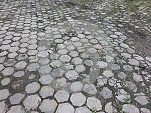 small white stone between the footrests of cement