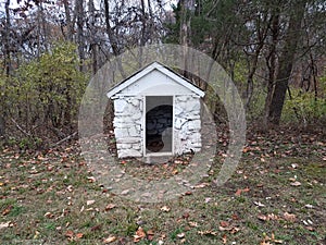 Small white stone storage shed building or structure