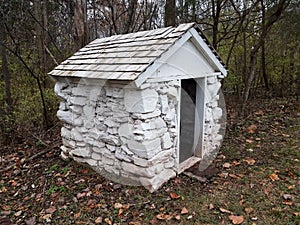 Small white stone storage shed building or structure