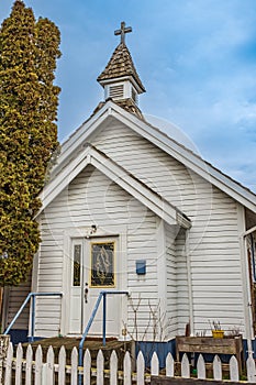 Small white wooden church in the country. A little white country church in rural Canada