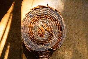 Small wickerwork on wooden table from above