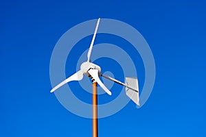 Small Wind Turbine on Blue Sky