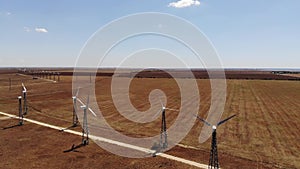 Small wind turbines with blades in the field aerial view. An old type of wind generator. alternative energy