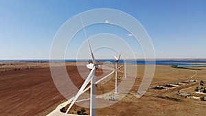 Small wind turbines with blades in the field aerial view. An old type of wind generator. alternative energy