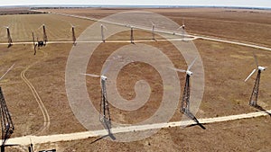 Small wind turbines with blades in the field aerial view. An old type of wind generator. alternative energy