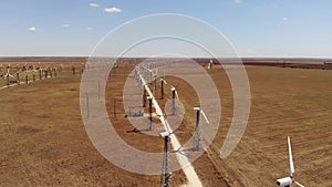 Small wind turbines with blades in the field aerial view. An old type of wind generator. alternative energy