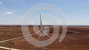 Small wind turbines with blades in the field aerial view. An old type of wind generator. alternative energy