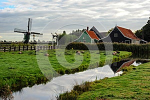 A small windmill in an old village of Holland.