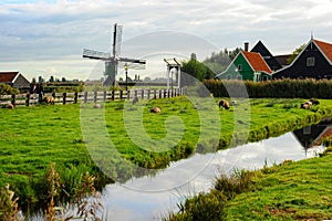 A small windmill in an old village of Holland.