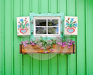 Small window with flowers painted