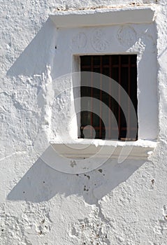 Small window at a Greek island church at Folegandros, Greece.