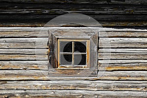 Small window in an old wooden house