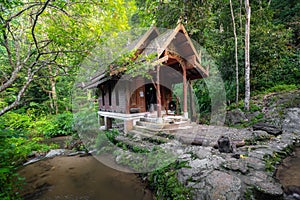 Small wood church thai style at kantrapruksa temple in Mae Kampong , surround by waterfall and evergreen foreste in Maekampong