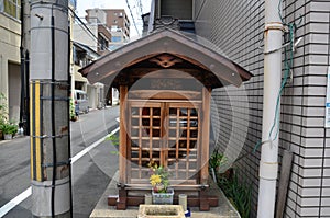 Small wood joss house or wooden little shrine on street of small