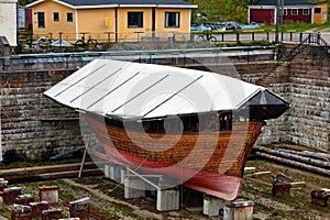 Small wood old boat in Shipyard