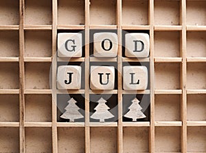 Small wooden blocks with the inscription God Jul, Scandinavian Merry Christmas