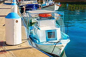 Small wooden boat painted in Greek blue and white