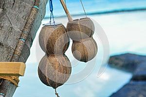 Small wooden bowls with ropes made from coconut shells