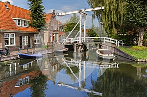Small wooden bridge over a canal in Monnickendam photo