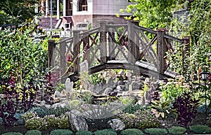 A small wooden bridge over the pond.