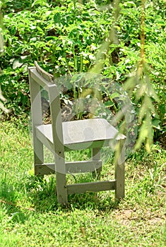 Small wooden chair in garden