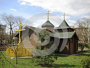 small wooden church on the street of Kiev
