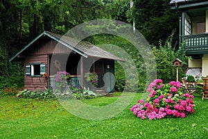 Small wooden cottage on the edge of the forest near Sankt Gilgen, the picturesque village by the Wolfgangsee.