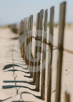 Small wooden fence in the sand